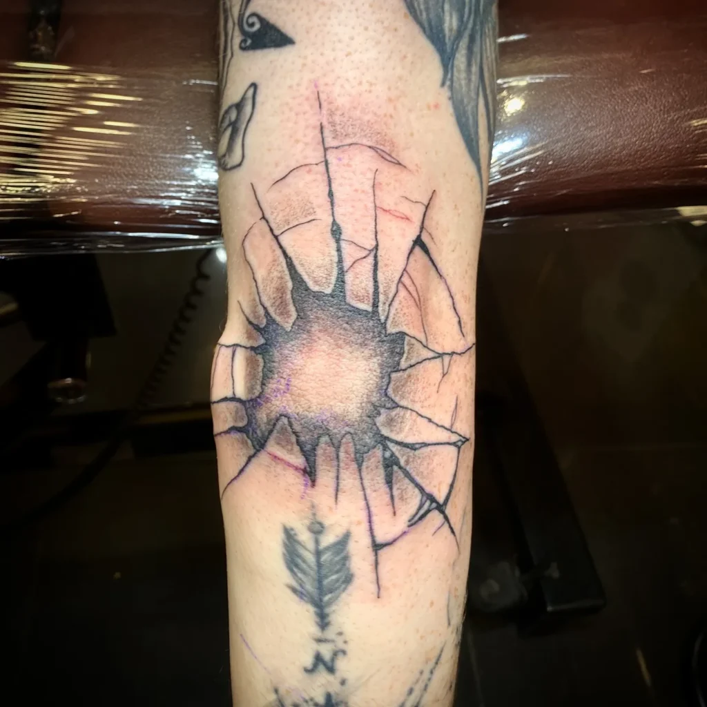 Shattered Glass Impact Tattoo