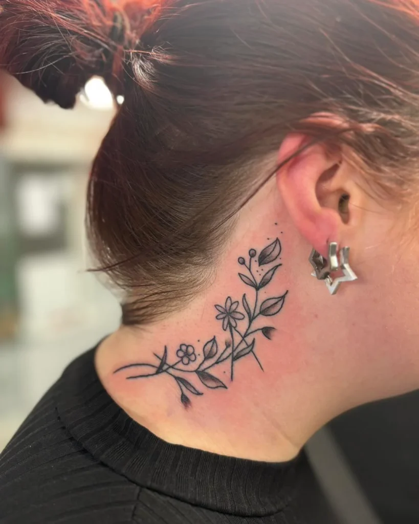 The Delicate Botanical Sweep Tattoo