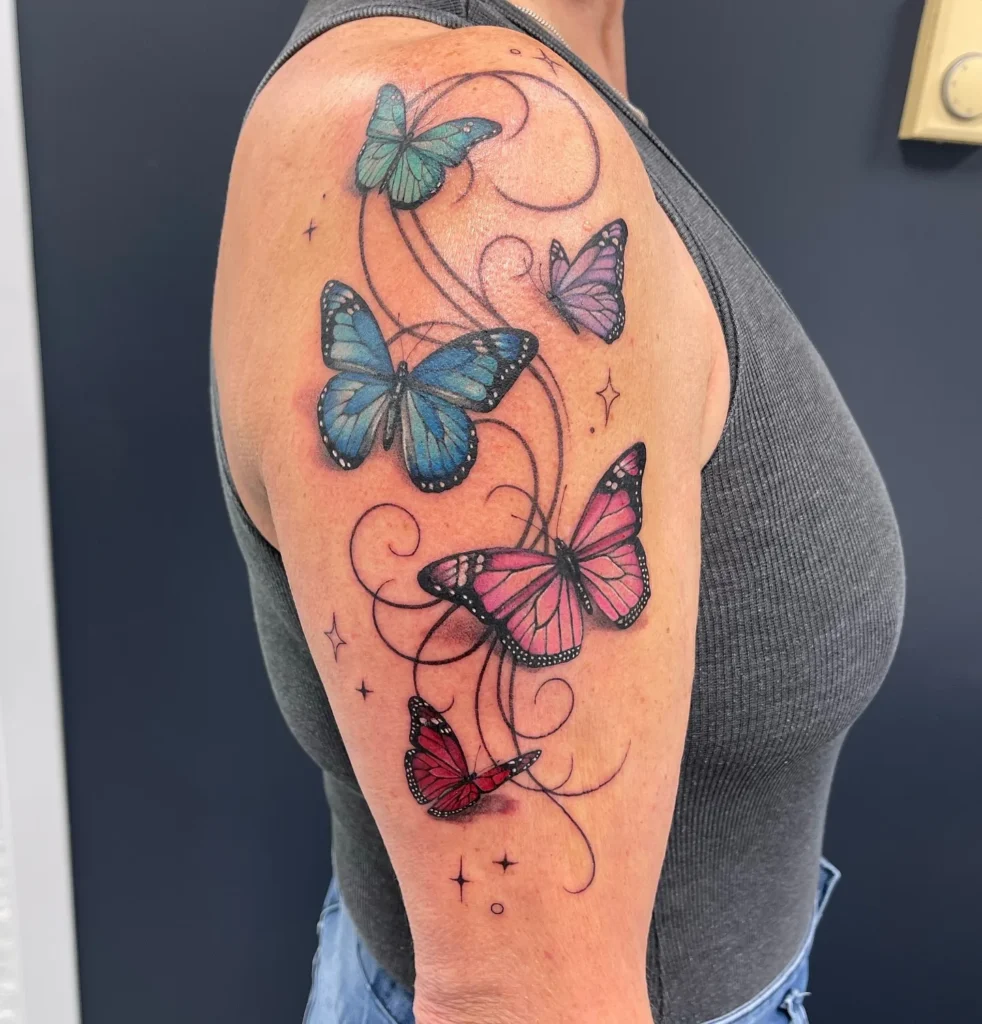 Vibrant Ethereal Butterfly Flight Tattoo
