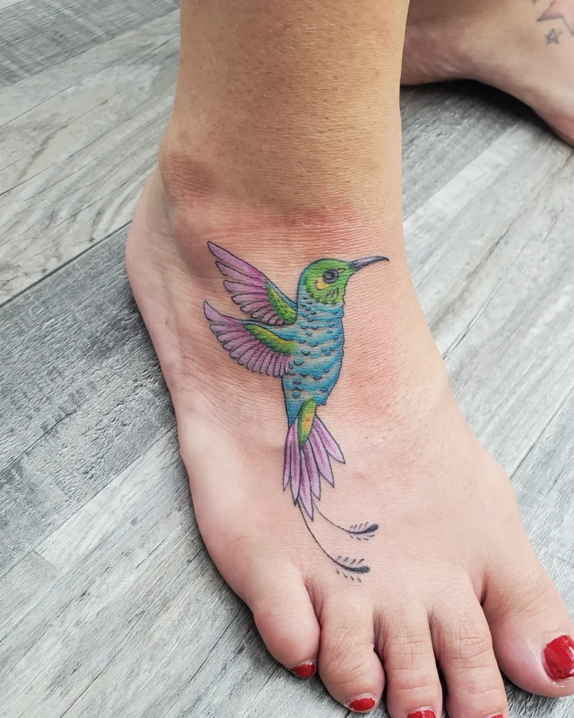Vibrant Hummingbird Foot Tattoo