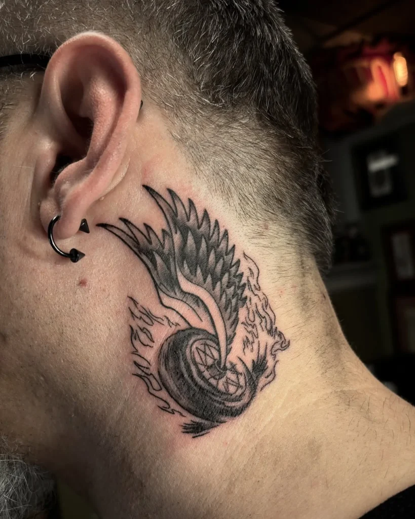 llustrative Winged Racing Wheel Tattoo