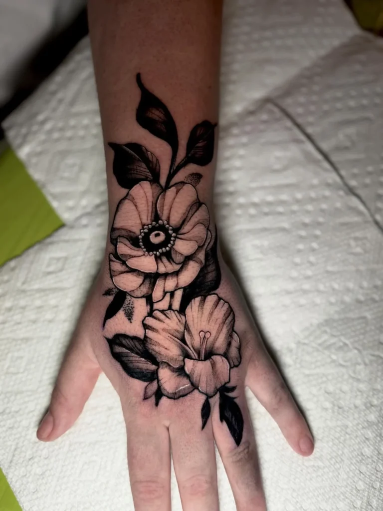 Black Work Flower Hand Tattoo