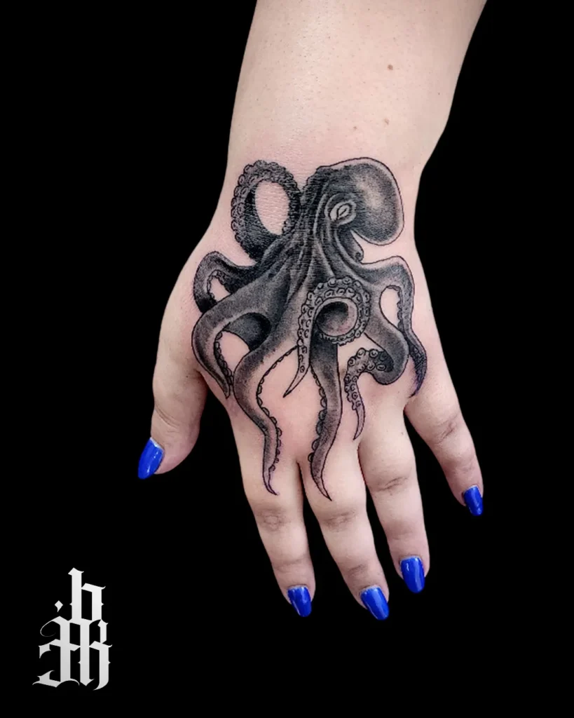 Black and Grey Octopus Hand Tattoo