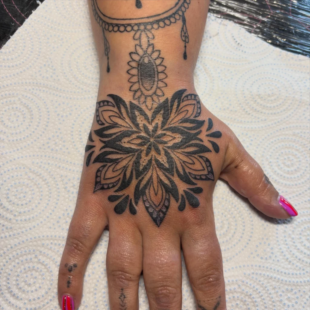 Bold Ornamental Mandala Hand Tattoo