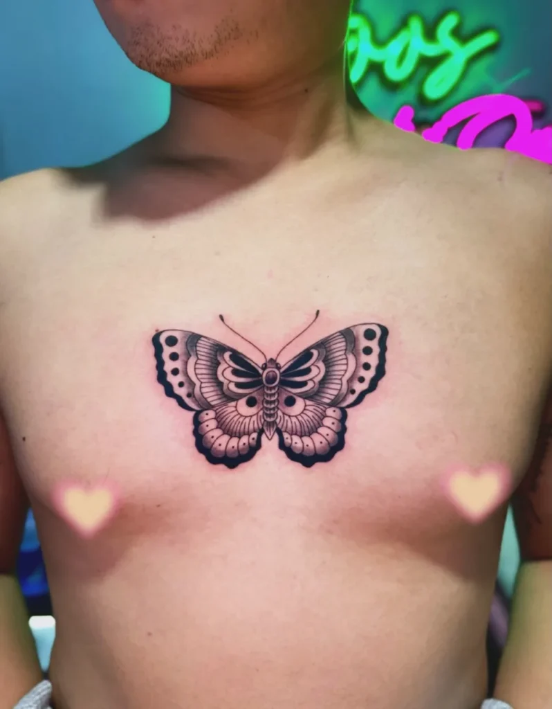 Bold Symmetrical Sternum Butterfly Tattoo