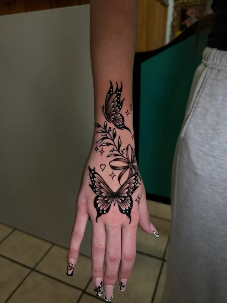 Butterfly and Botanical Flow Tattoo