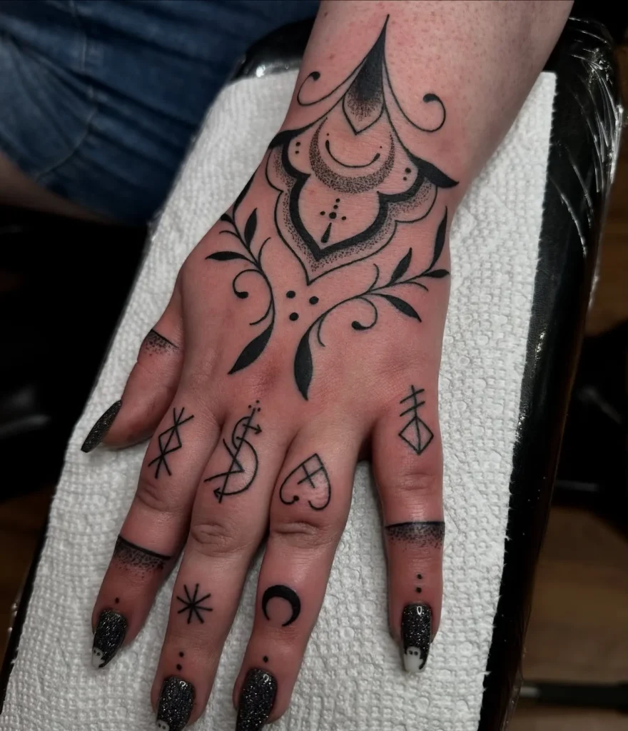Ornamental Blackwork with Symbolic Finger Tattoo
