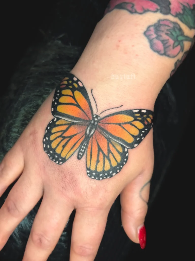 Realistic Monarch Hand Tattoo