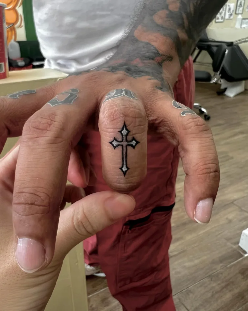 Sharp Gothic Cross Finger Tattoo