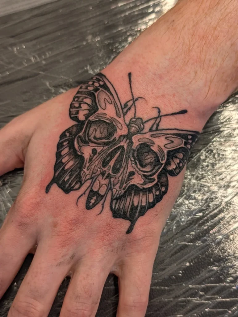 Skull Butterfly Hand Tattoo