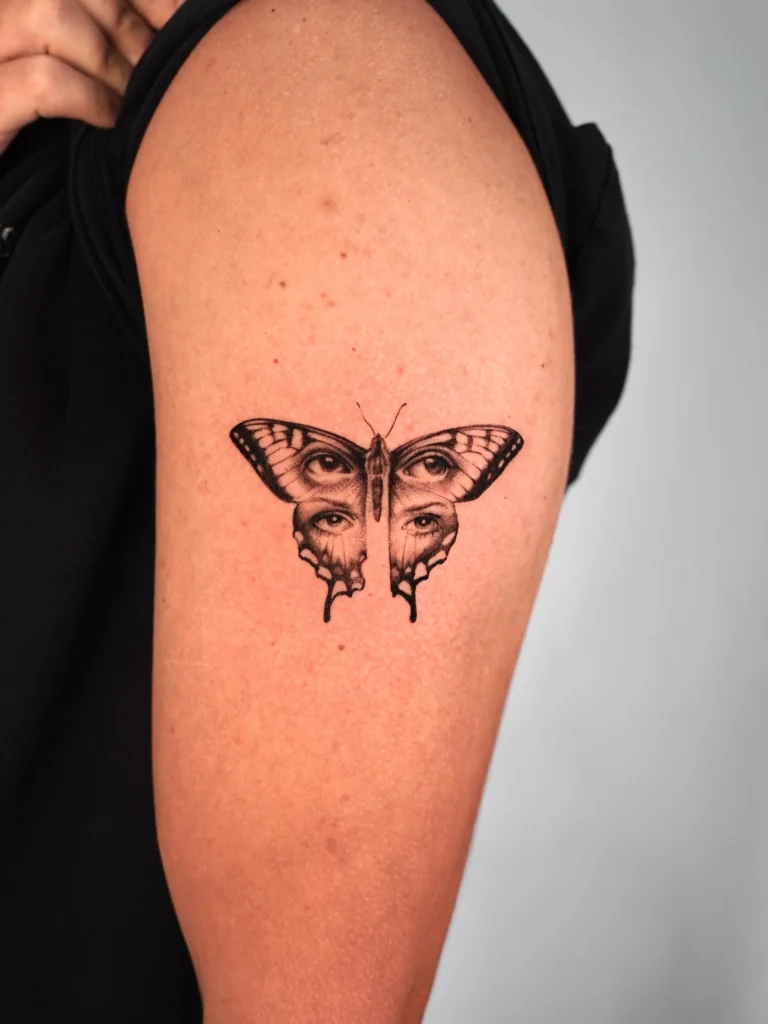 Surrealist Multi-Eye Butterfly Tattoo