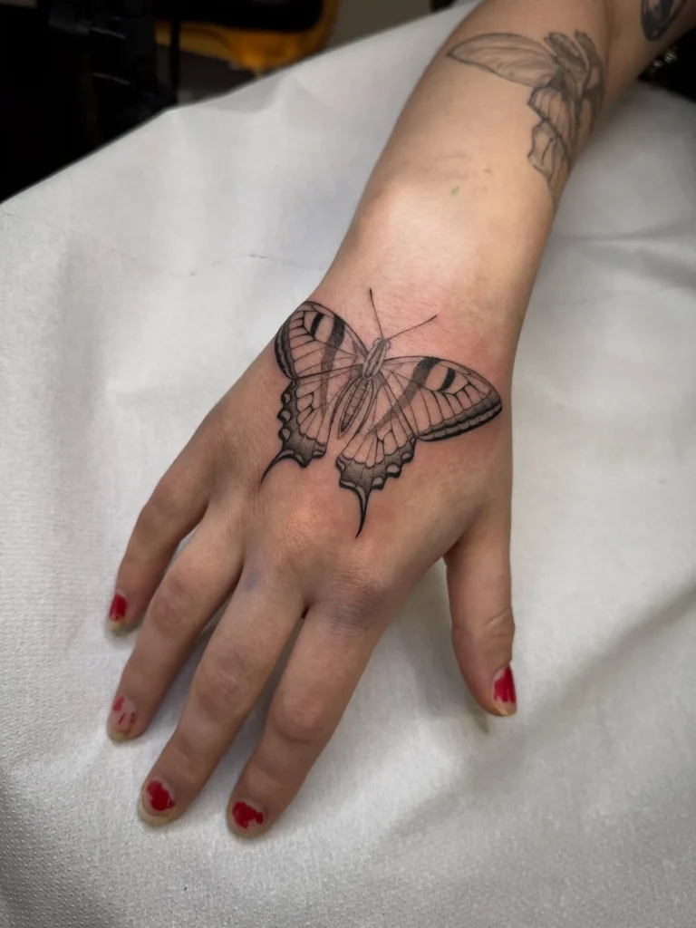 Swallowtail Hand Butterfly Tattoo