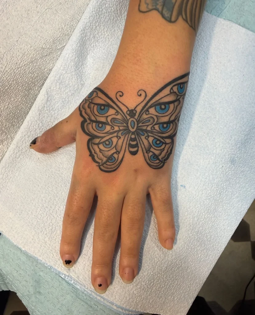 Trippy Butterfly Hand Tattoo