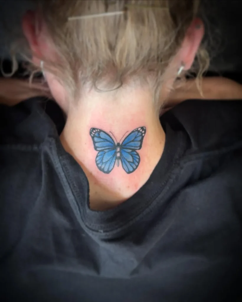 Vibrant Blue Nape Butterfly Tattoo